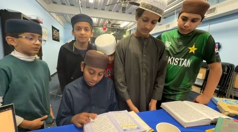 Children learning the Quran at Madrassah Naeemiyah